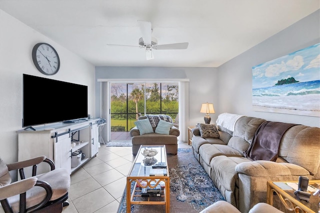 tiled living room featuring ceiling fan