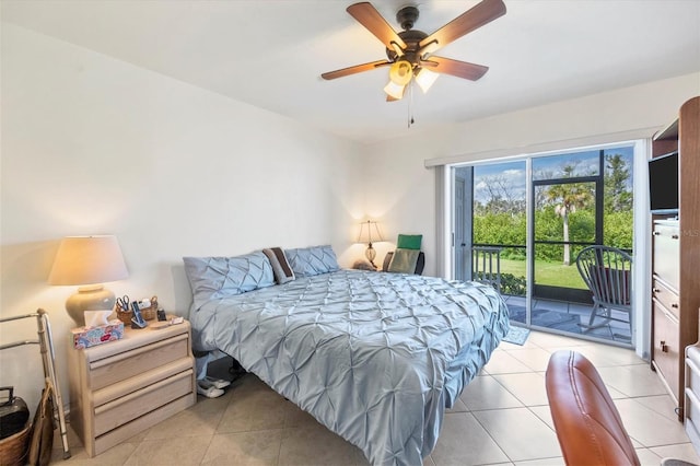 tiled bedroom featuring ceiling fan and access to outside