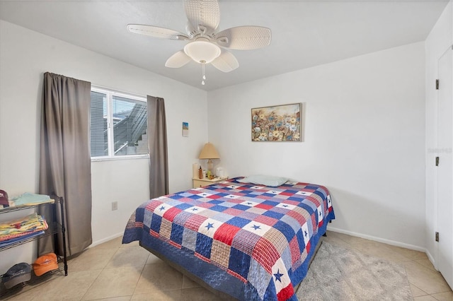 tiled bedroom with ceiling fan