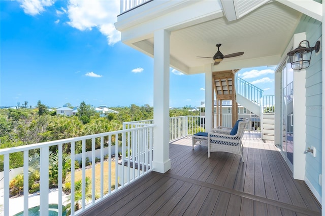 wooden terrace featuring ceiling fan