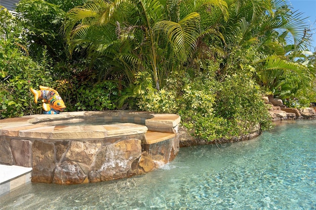 view of pool featuring pool water feature