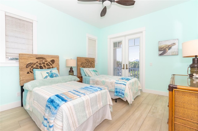 bedroom with french doors, ceiling fan, access to exterior, and light wood-type flooring