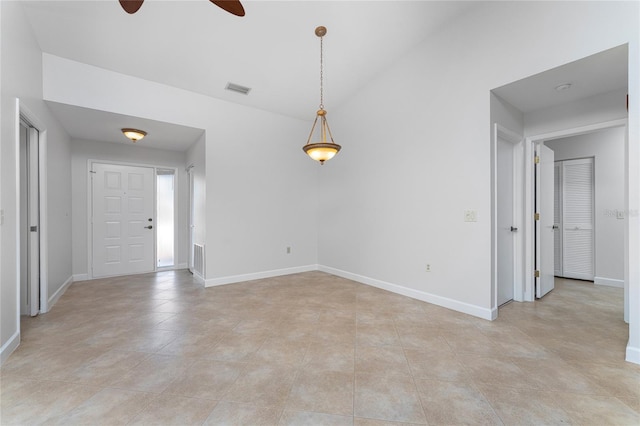 tiled entryway featuring ceiling fan