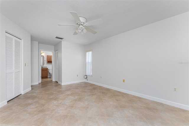 unfurnished bedroom featuring a closet, ceiling fan, and light tile floors