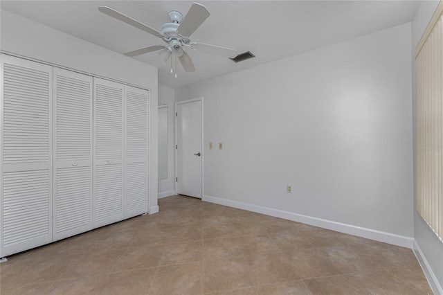 unfurnished bedroom featuring a closet, ceiling fan, and light tile floors