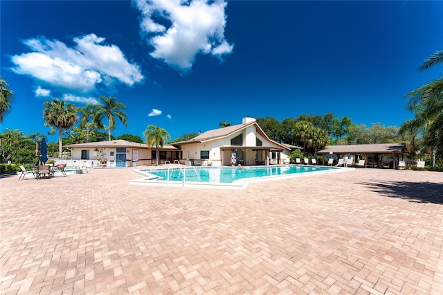 view of swimming pool featuring a patio area