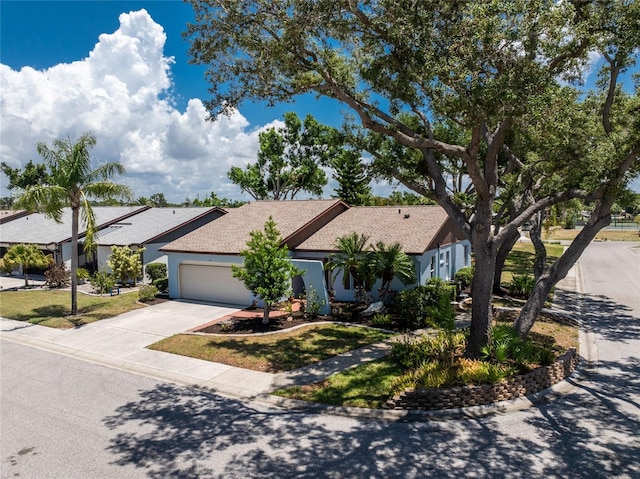 view of front of property with a garage and driveway