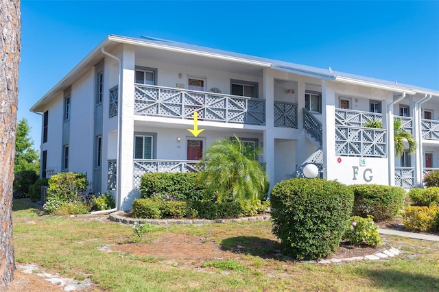 view of front of house with a balcony