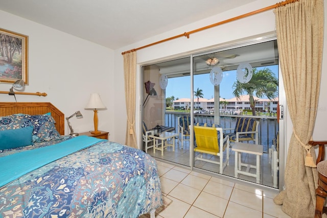 bedroom featuring light tile floors and access to outside