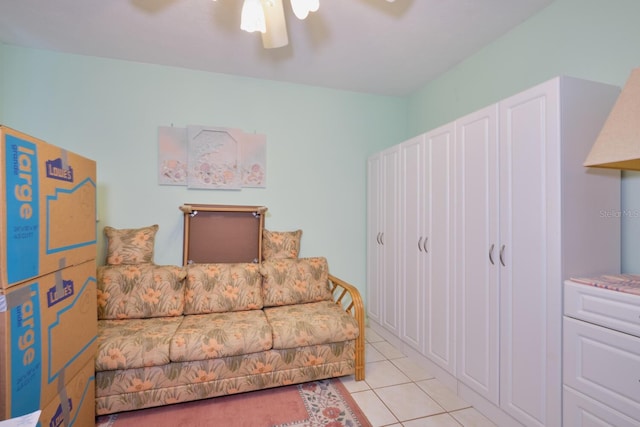 interior space with ceiling fan and light tile floors