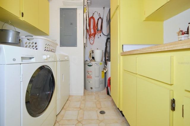 washroom with cabinets, washer and dryer, light tile floors, and water heater