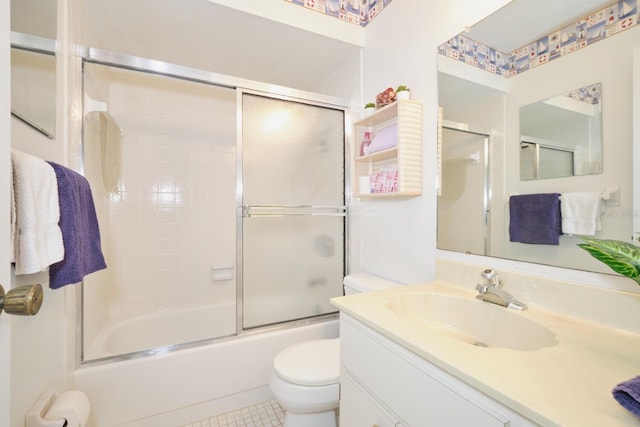 full bathroom with bath / shower combo with glass door, toilet, tile floors, and large vanity