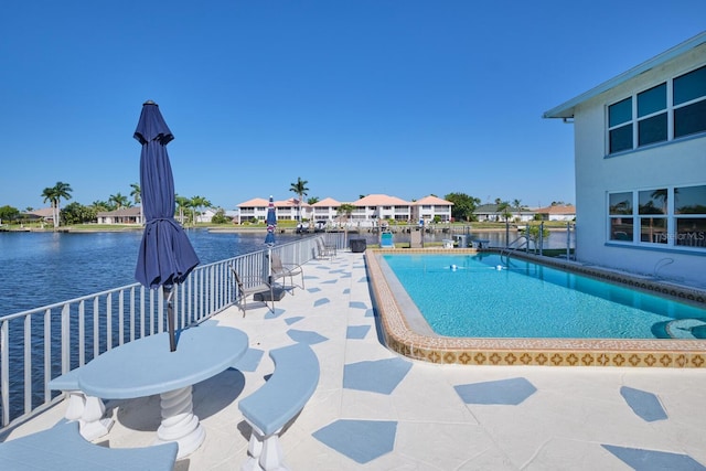 view of swimming pool featuring a patio area