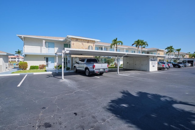 view of vehicle parking with a carport