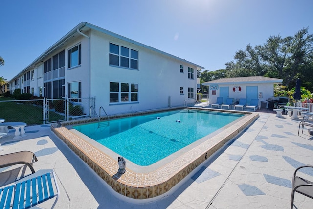 view of pool featuring a patio