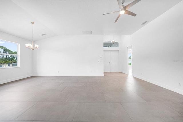 unfurnished room with vaulted ceiling and ceiling fan with notable chandelier