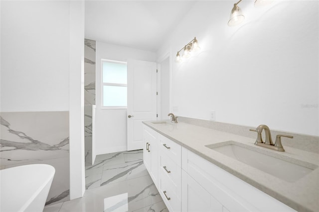 bathroom featuring a tub to relax in and vanity