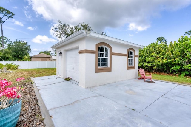 view of property exterior with a garage