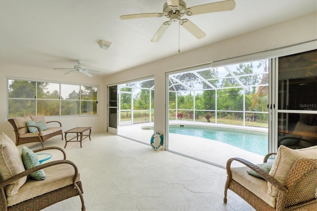 sunroom / solarium with a pool and ceiling fan