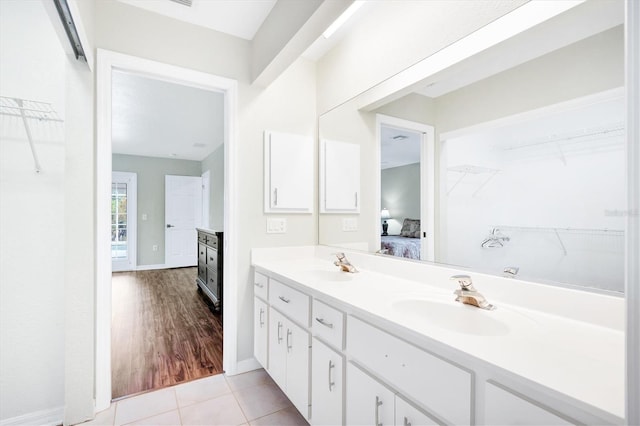 bathroom featuring hardwood / wood-style floors and vanity