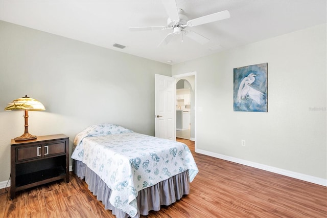 bedroom featuring hardwood / wood-style flooring and ceiling fan