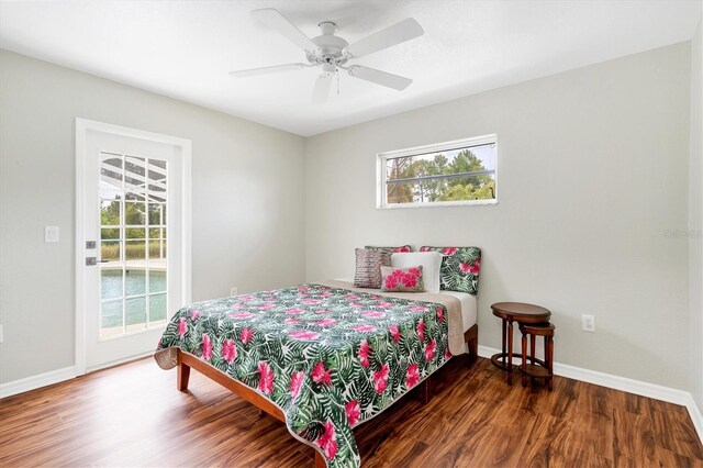 bedroom with ceiling fan and dark hardwood / wood-style flooring