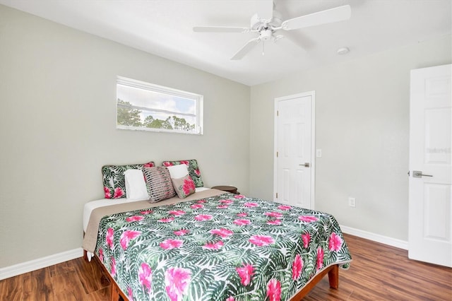 bedroom featuring ceiling fan and dark hardwood / wood-style flooring