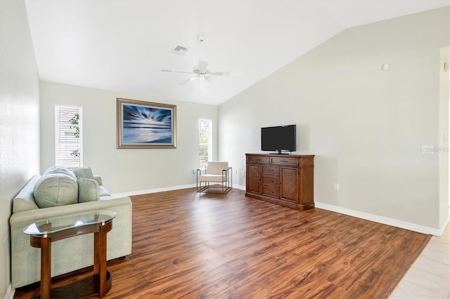 living room with hardwood / wood-style floors, ceiling fan, and lofted ceiling