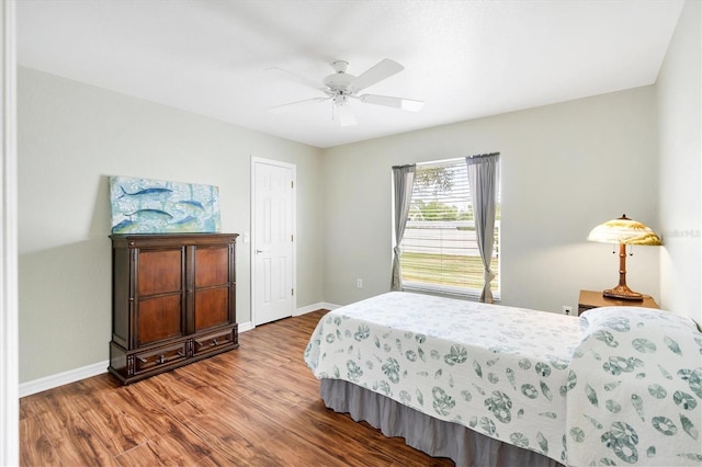 bedroom with ceiling fan and wood-type flooring