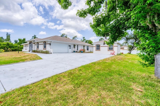 ranch-style home with a front yard and a garage