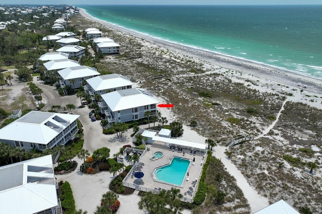 drone / aerial view with a view of the beach and a water view