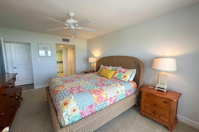 carpeted bedroom featuring a closet and ceiling fan