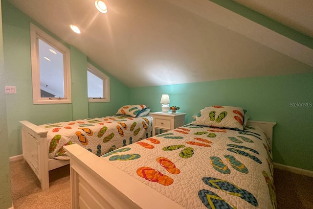 carpeted bedroom with vaulted ceiling