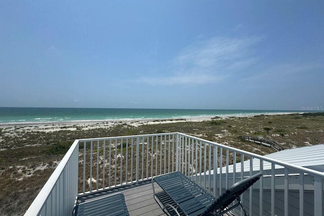 exterior space featuring a view of the beach and a water view