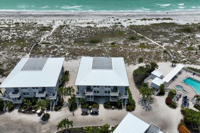 aerial view with a beach view and a water view