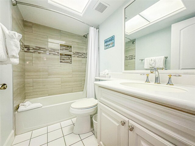 full bathroom with toilet, tile flooring, vanity, and shower / bath combo