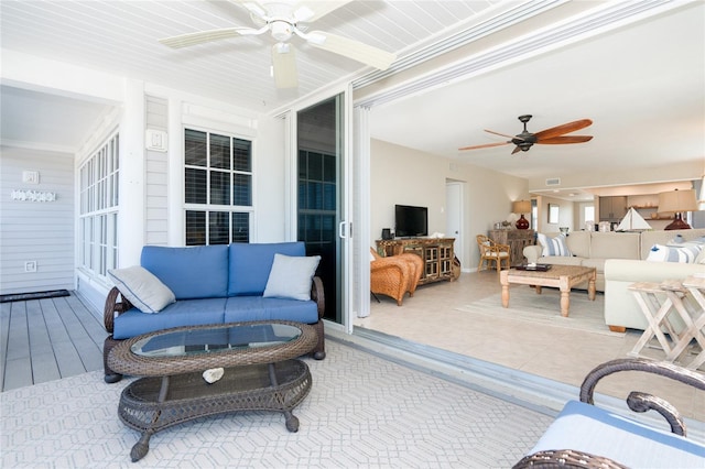 living room with tile floors and ceiling fan