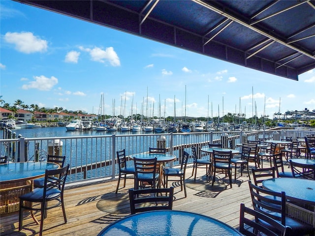 exterior space featuring a dock and a water view