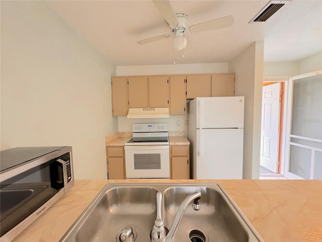 kitchen with ceiling fan, light brown cabinetry, sink, and white appliances