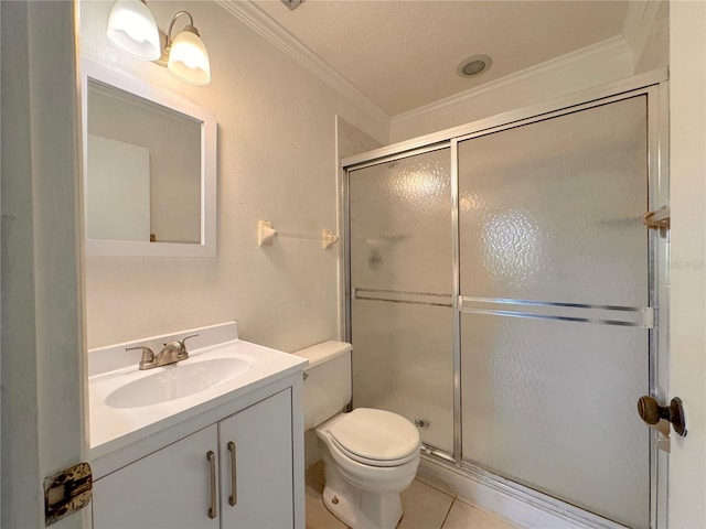 bathroom featuring tile patterned flooring, a shower with door, toilet, and vanity