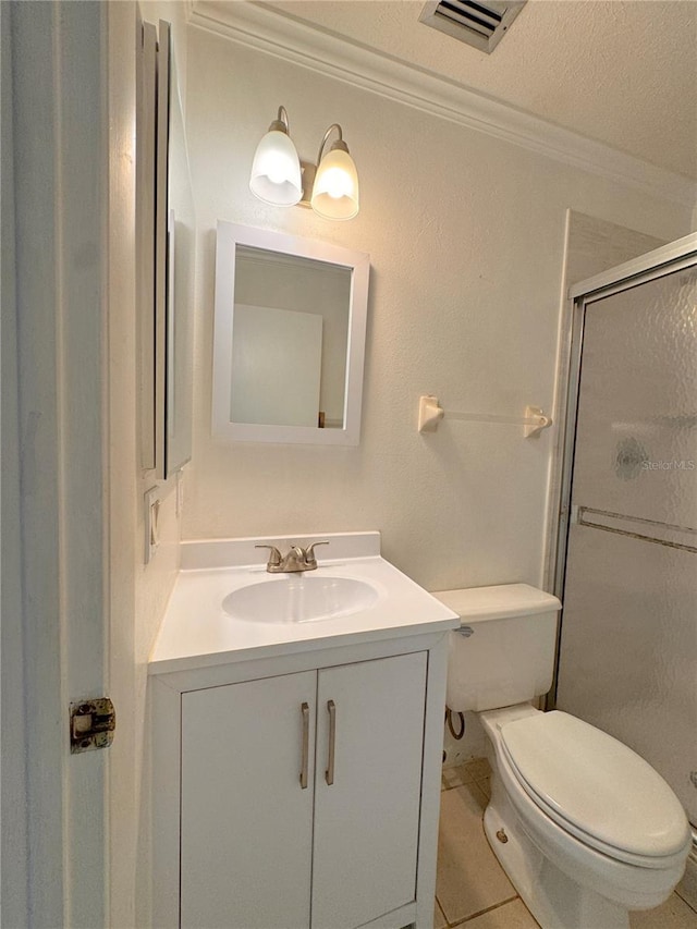 bathroom featuring a shower with door, toilet, tile patterned flooring, vanity, and a textured ceiling