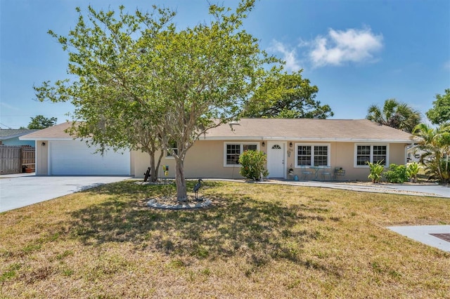 ranch-style home featuring a front yard and a garage