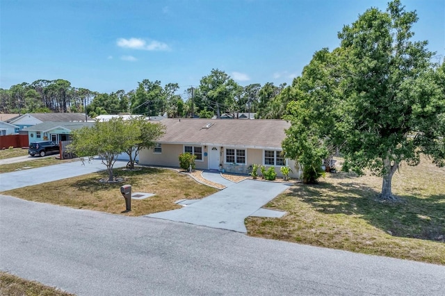 ranch-style home with a front yard