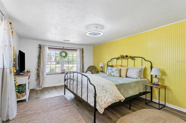 bedroom featuring dark hardwood / wood-style floors