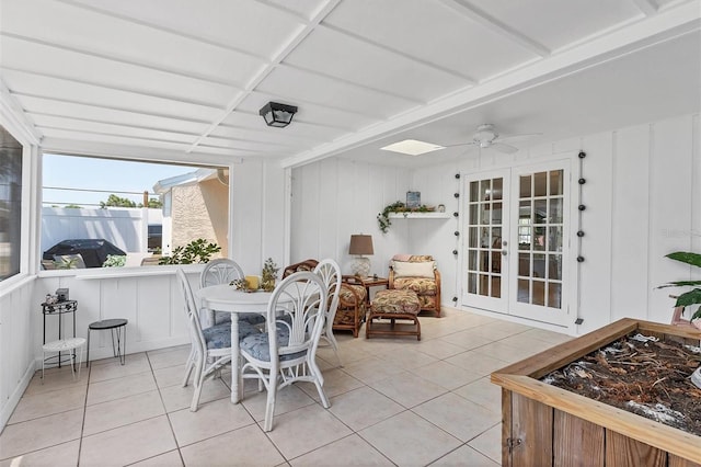 sunroom / solarium with ceiling fan and french doors