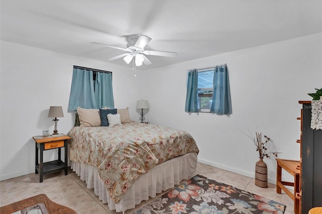 bedroom featuring tile floors and ceiling fan