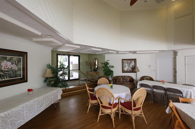 dining room with ceiling fan and dark hardwood / wood-style flooring