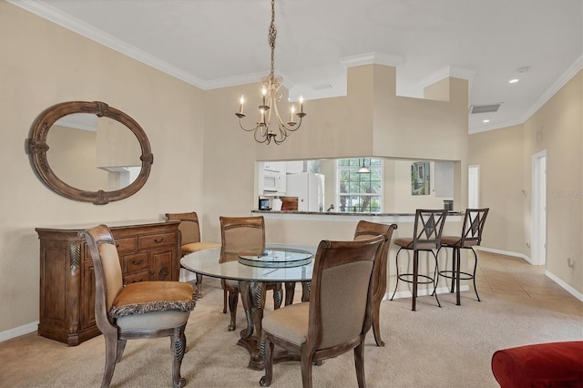 carpeted dining area featuring crown molding and an inviting chandelier