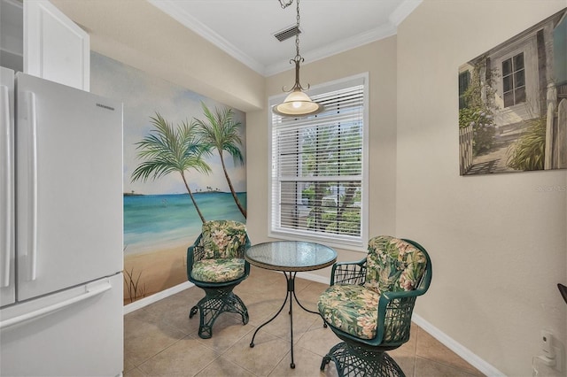 living area with light tile patterned floors and ornamental molding