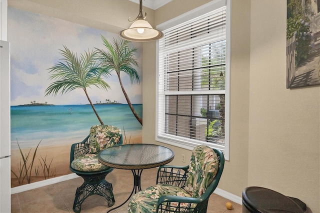 interior space with tile patterned flooring and a water view